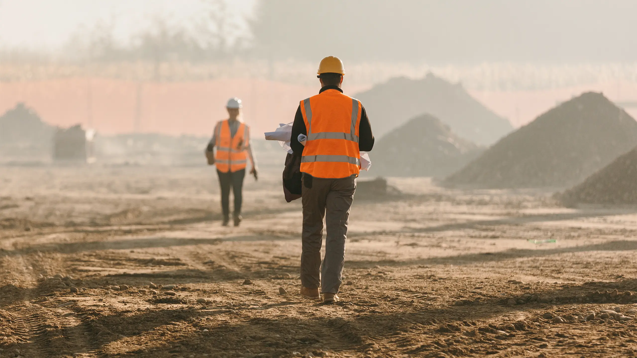 Construction workers evaluating work on site